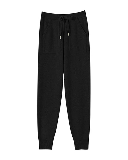 Black pants with a drawstring on a white background