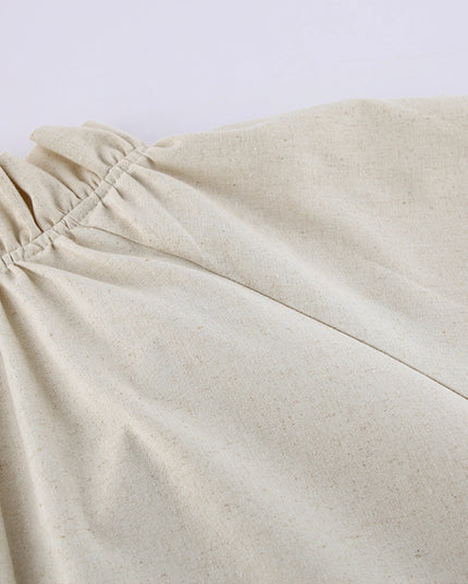 Close-up of beige pants on a light gray background