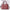 Pink handbag with gold accents on a white background