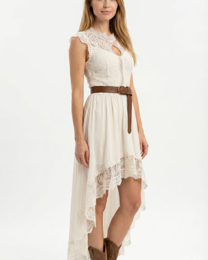 Woman wearing a white lace dress with a brown belt and boots on a white background