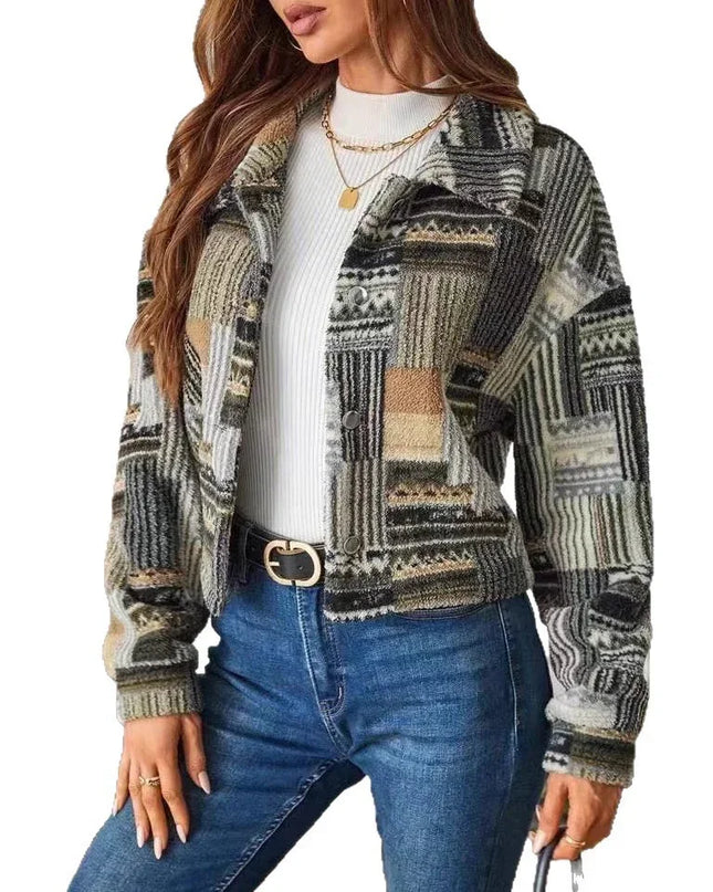 Woman wearing a patterned jacket and blue jeans on a white background