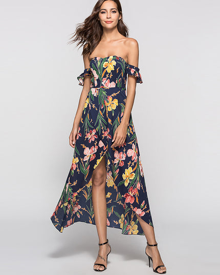 Woman wearing a floral strapless dress on a plain background