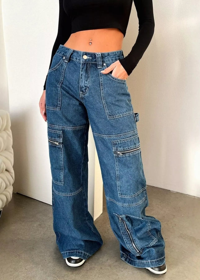 Person wearing blue wide-leg jeans and a black top indoors.