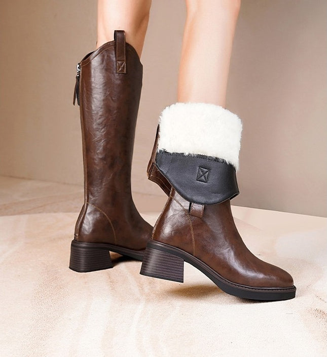Brown leather boots with white fur lining on a neutral background