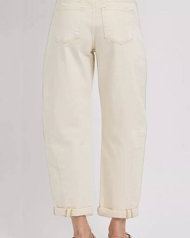 Beige pants worn by a person on a white background