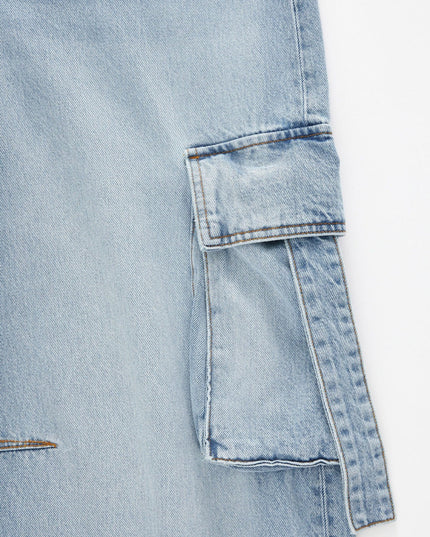 Close-up of a light blue denim jacket on a white background