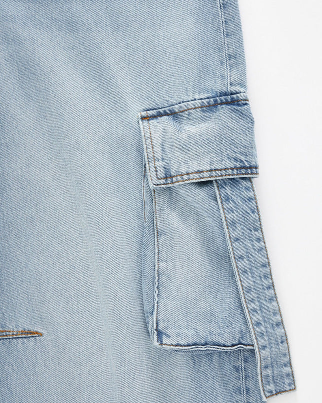Close-up of a light blue denim jacket on a white background
