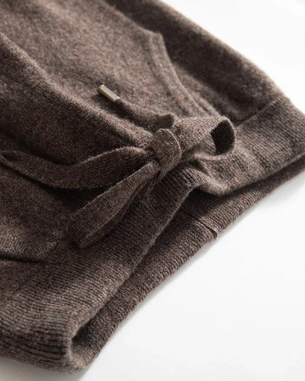 Folded brown sweater on a white background