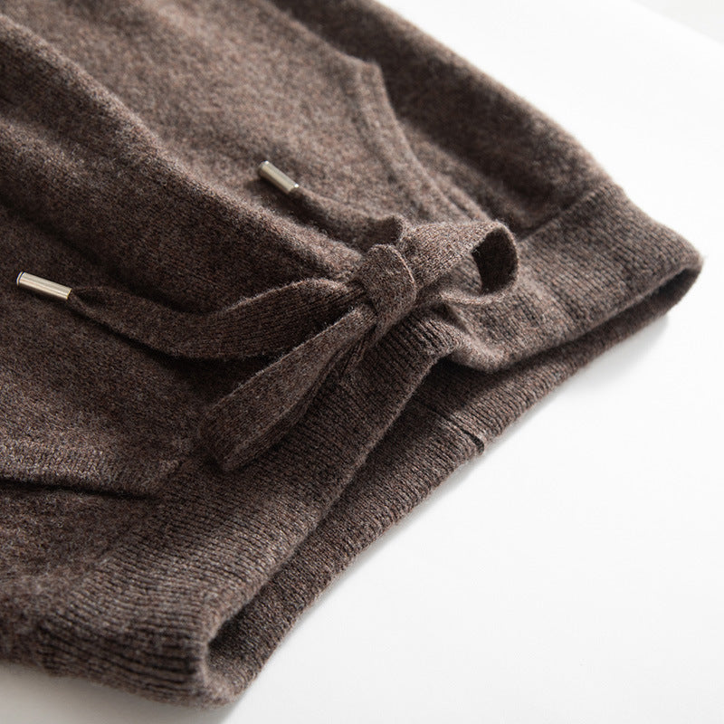 Folded brown sweater on a white background