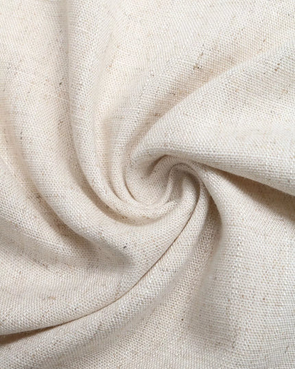 Close-up of beige fabric with a swirling pattern