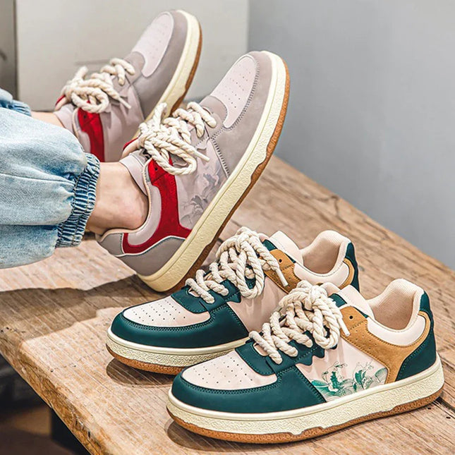 Two pairs of colorful sneakers on a wooden surface with a neutral background.