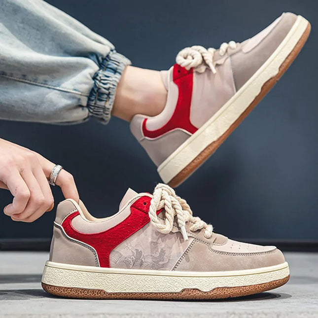 Beige and red sneakers with floral pattern on a dark background