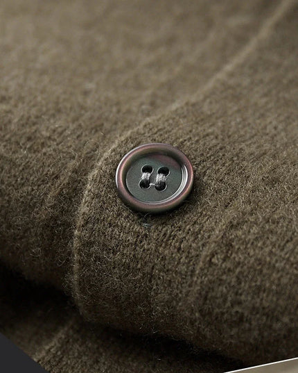 Close-up of a button on textured brown fabric with 'fabric exhibit' text.