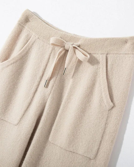 Beige drawstring pants on a light background