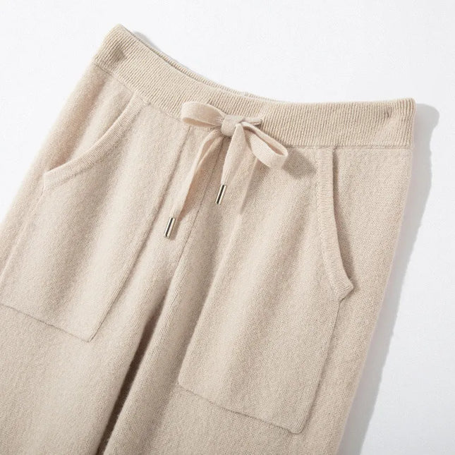 Beige drawstring pants on a light background