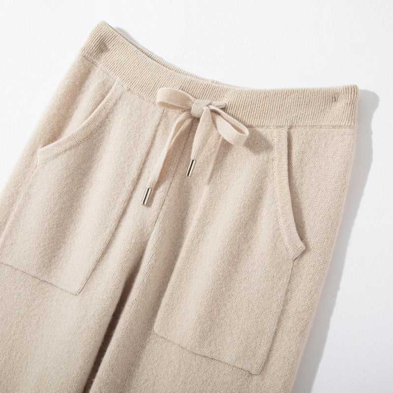 Beige drawstring pants on a light background