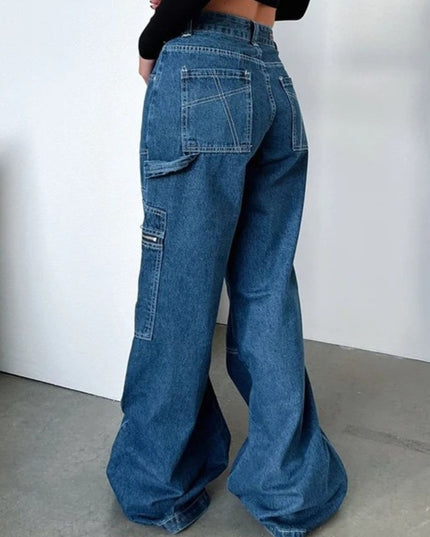 Person wearing blue flared jeans against a white background