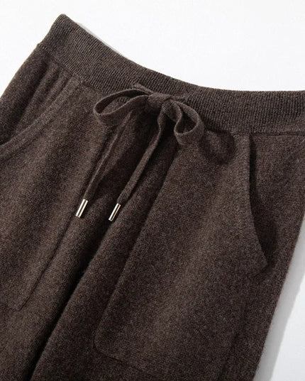 Brown drawstring pants on a white background