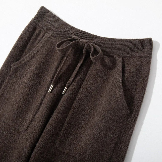 Brown drawstring pants on a white background