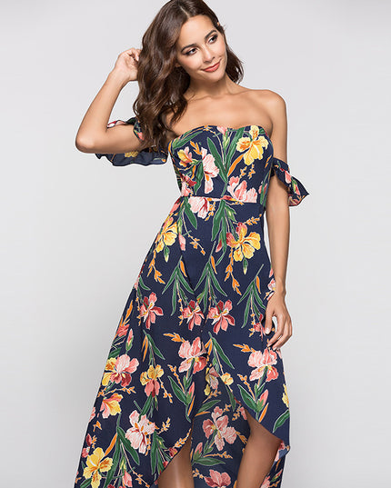 Woman wearing a strapless floral dress on a plain background