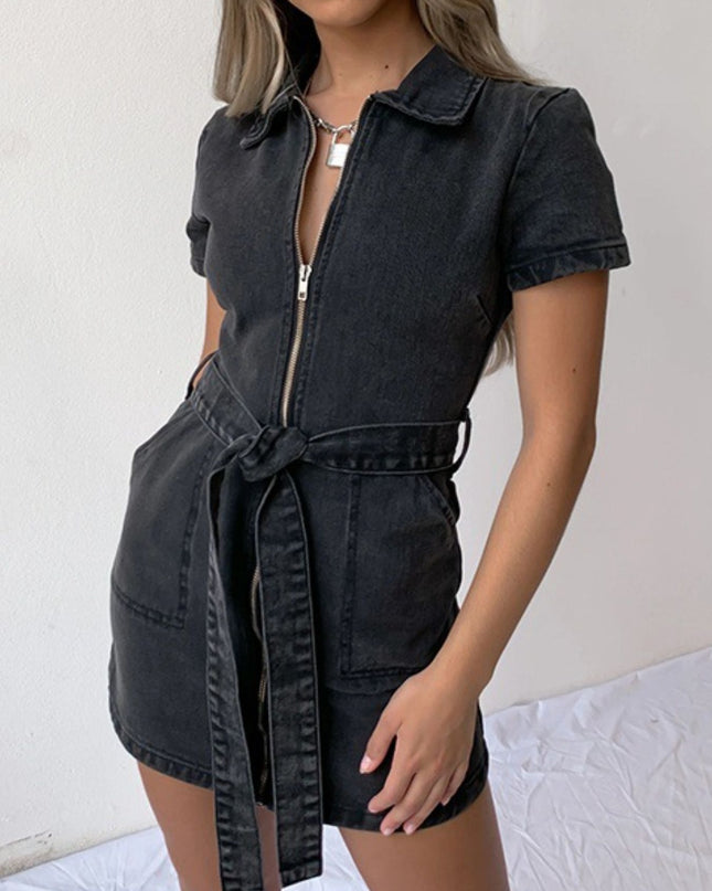 Black denim dress with a belt worn by a person on a white background
