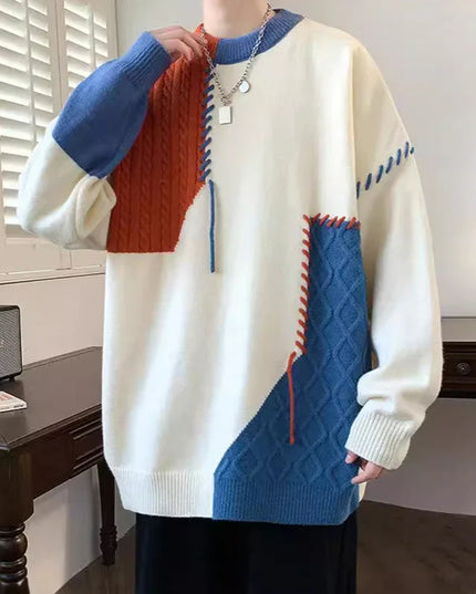 Person wearing a colorful sweater with geometric pattern in a room.