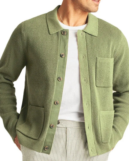 Green cardigan worn by a person on a white background