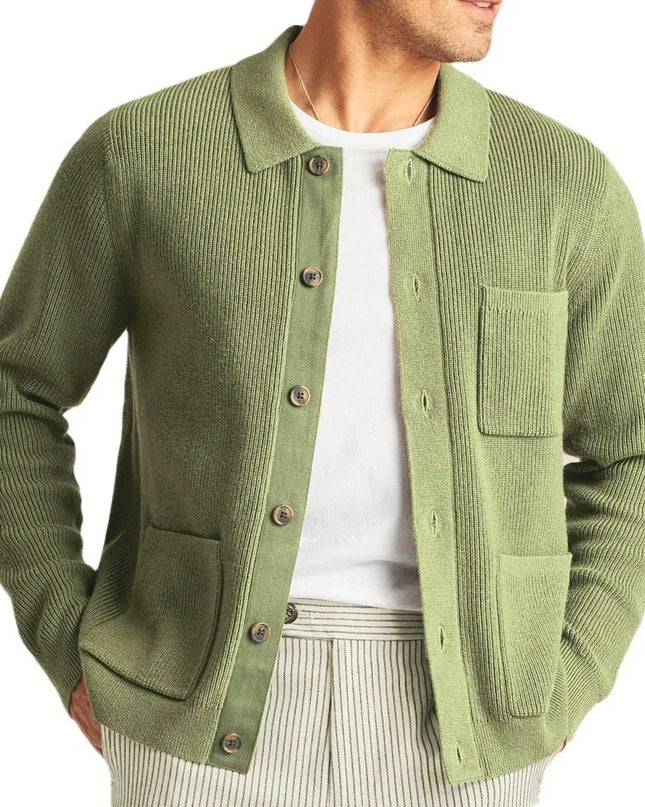 Green cardigan worn by a person on a white background