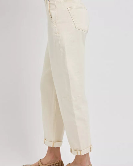 Beige pants worn by a person on a white background
