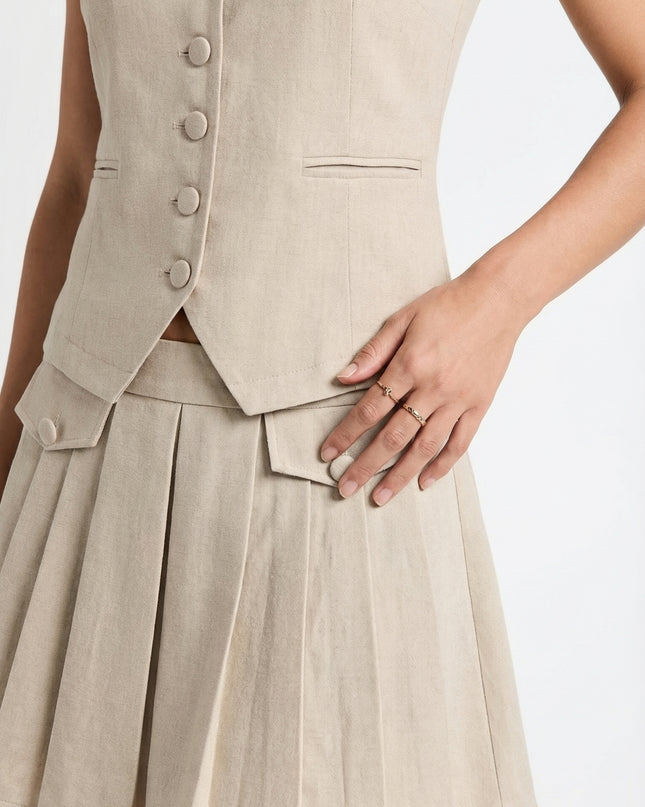 Beige vest and skirt set on a white background