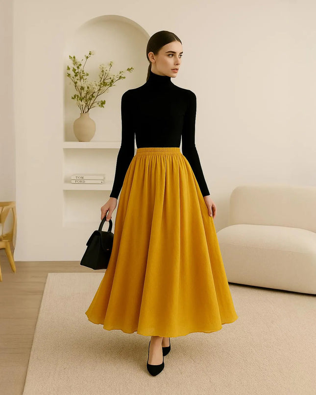 Woman wearing a black turtleneck and yellow skirt in a modern living room.