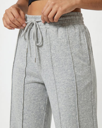 Gray sweatpants with a black top on a white background