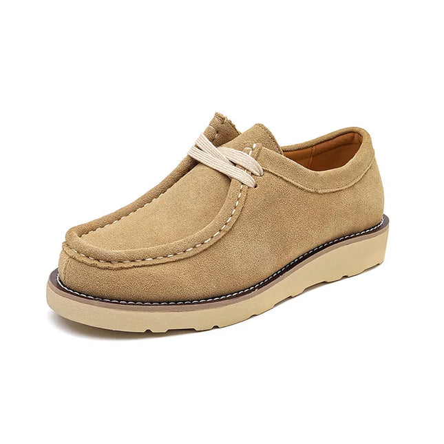 Beige loafer shoe on a white background