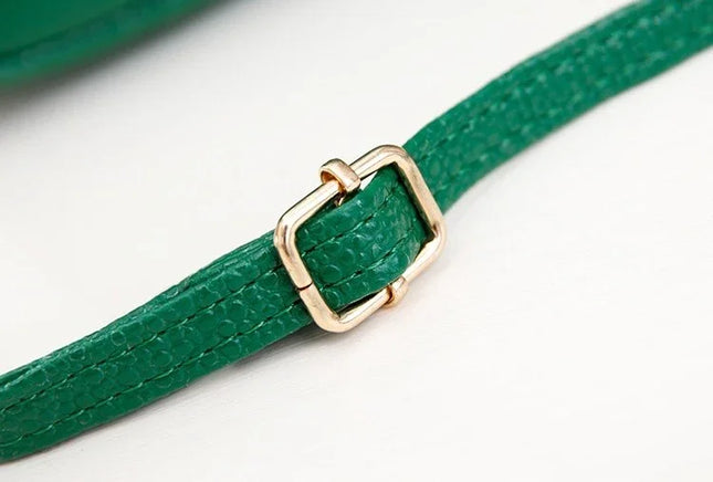 Green leather strap with a gold buckle on a white background