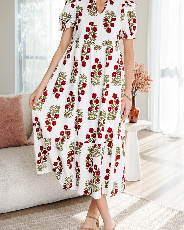 Woman wearing a floral dress in a living room setting