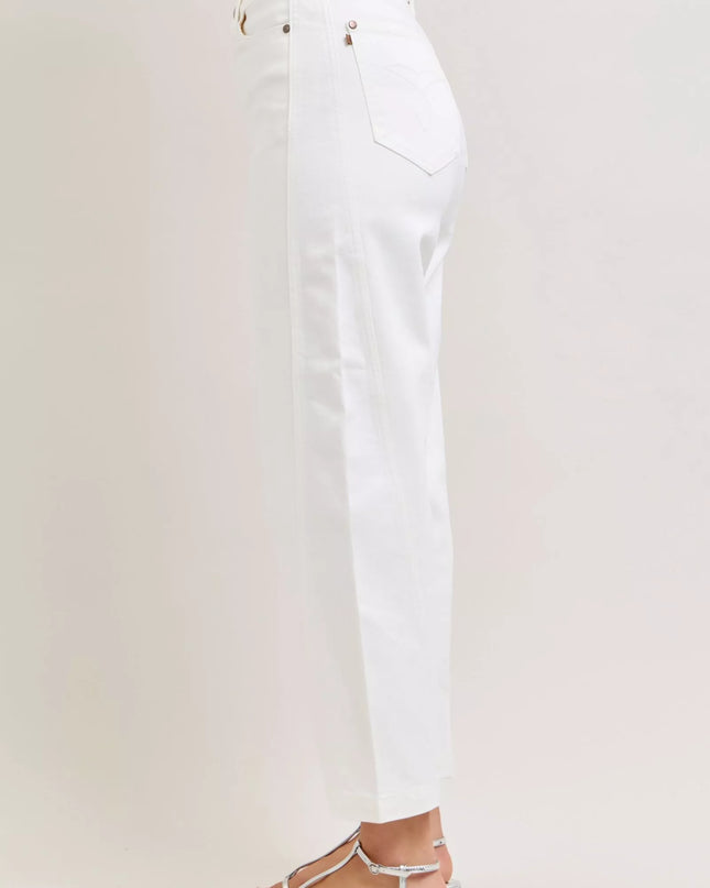 White pants worn by a person on a white background