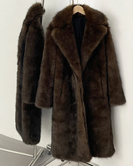 Brown fur coat on a hanger against a white background