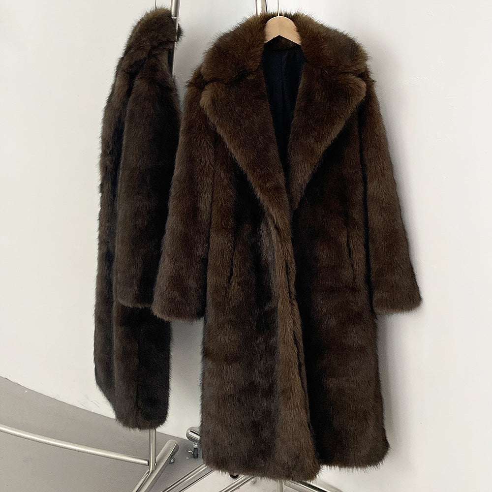 Brown fur coat on a hanger against a white background