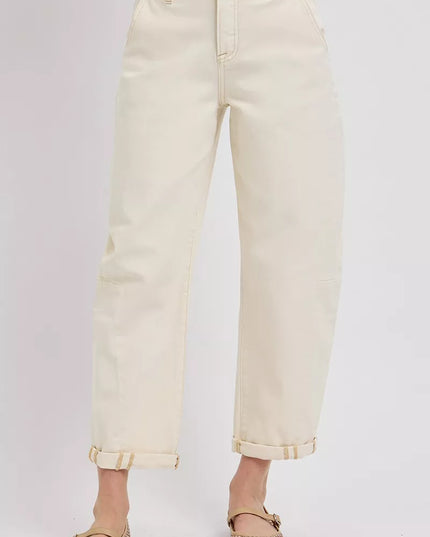 Beige jeans worn by a person on a light gray background