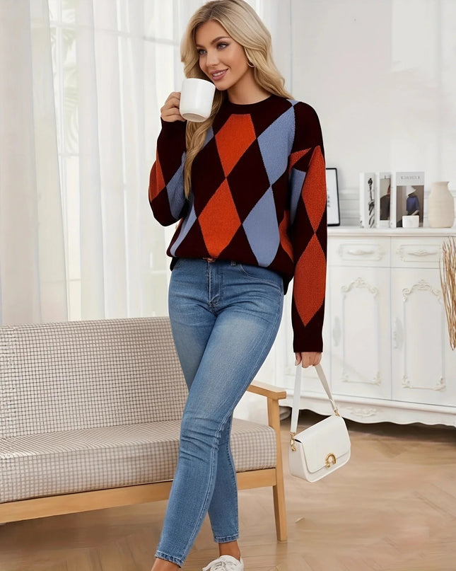 Woman in a colorful sweater and jeans holding a mug in a living room.