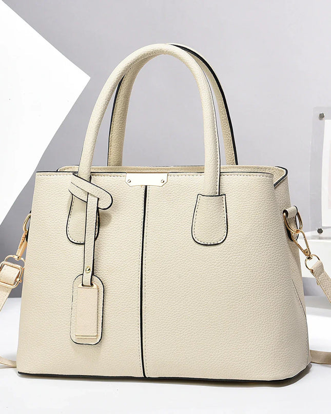 Beige handbag with a strap on a white background