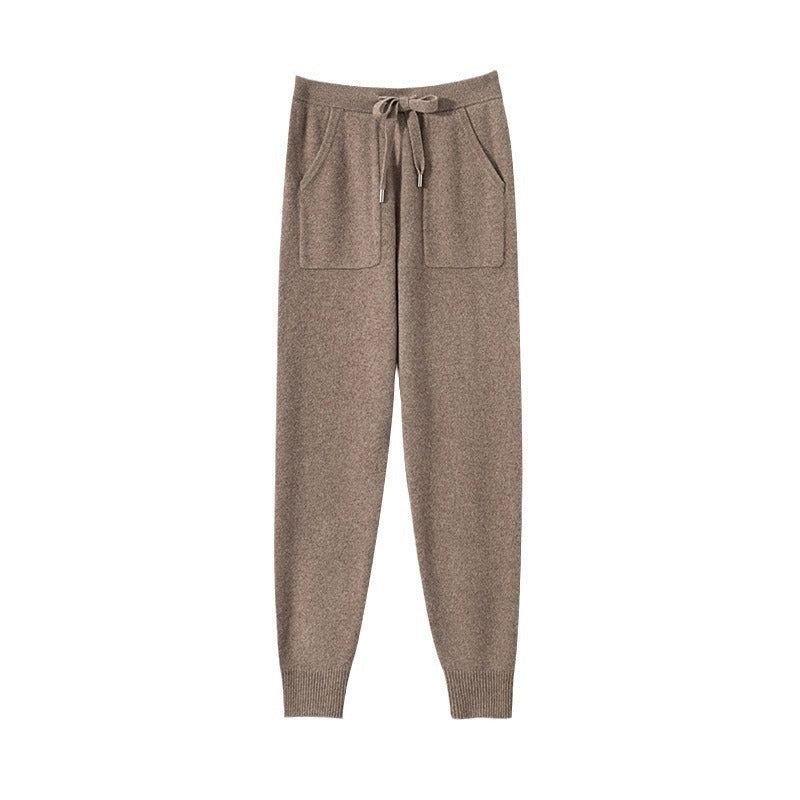 Brown jogger pants with a drawstring on a white background