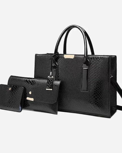 Set of black handbags with a textured pattern on a white background