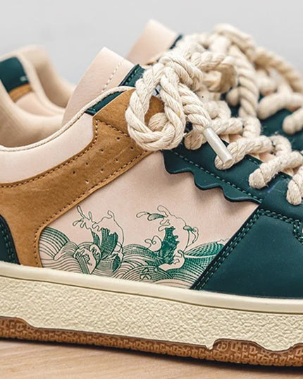 Close-up of a sneaker with green and brown design on a light background