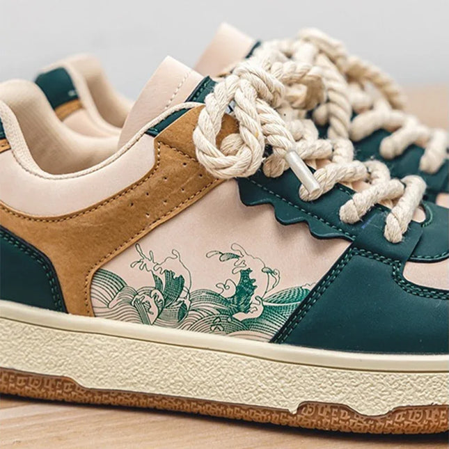 Close-up of a sneaker with green and brown design on a light background