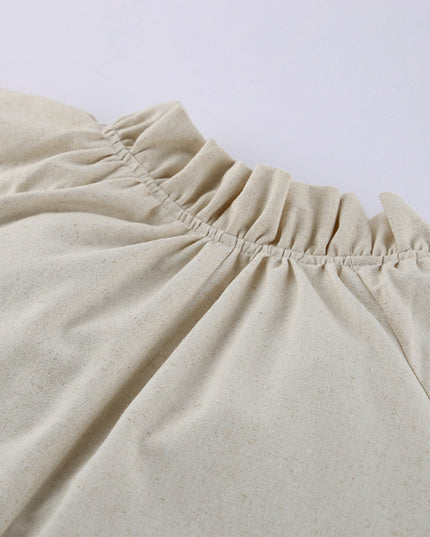 Close-up of beige pants with a plain background