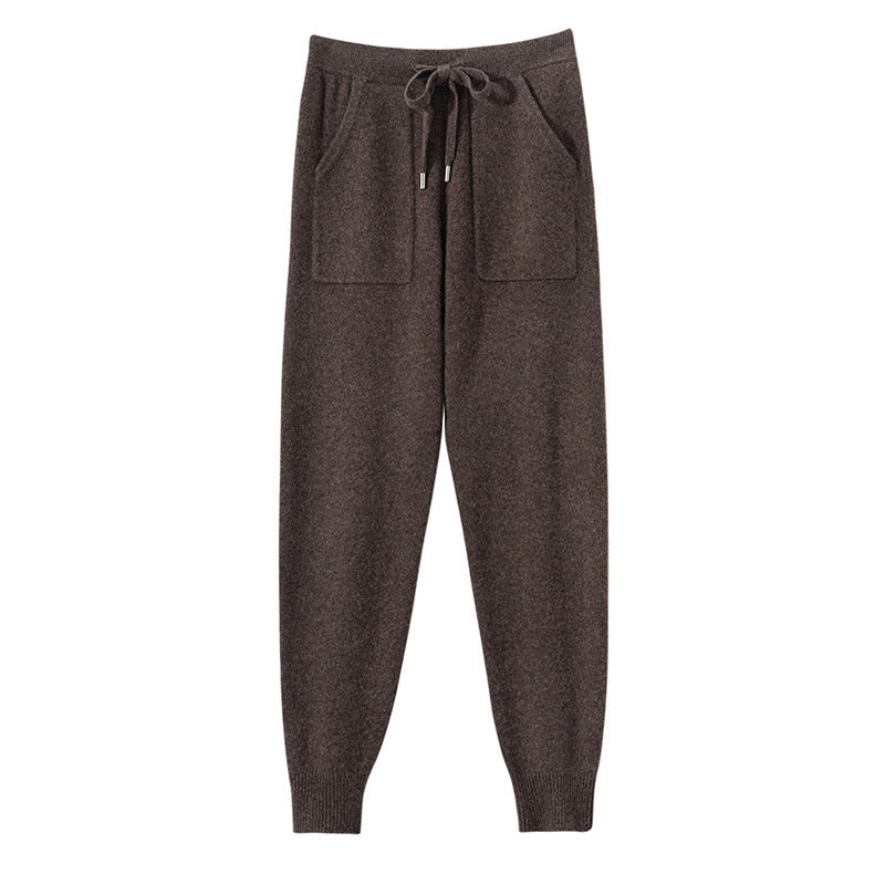 Brown jogger pants with a drawstring on a white background