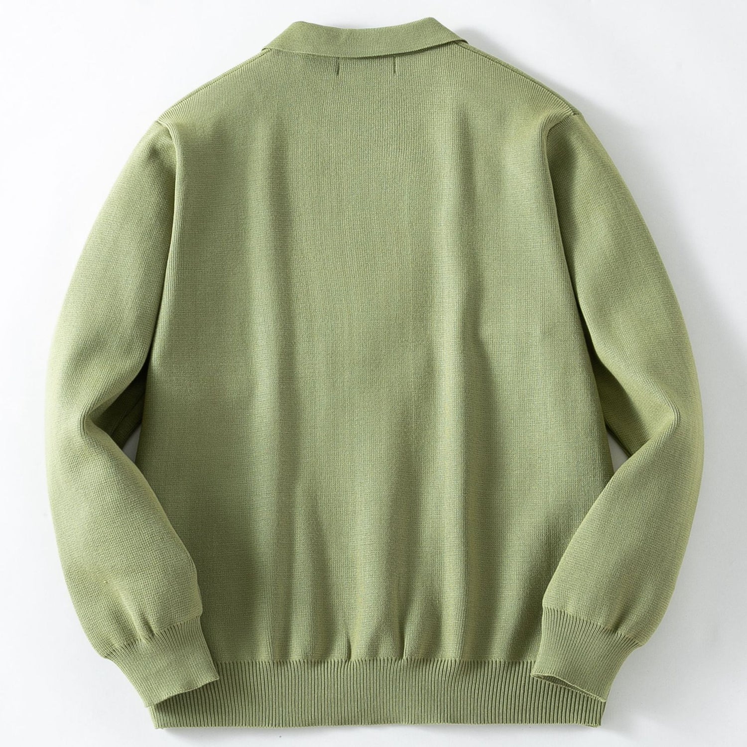 Green sweater on a white background