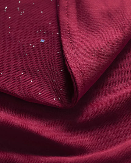 Close-up of burgundy fabric with small white dots