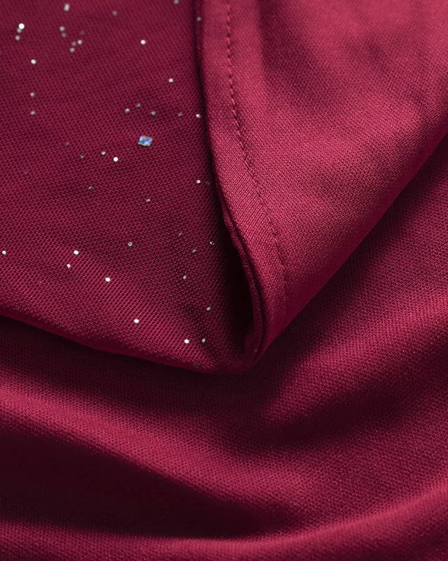 Close-up of burgundy fabric with small white dots